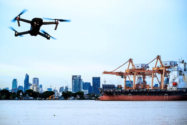Hobbyist drone flying near shipping port