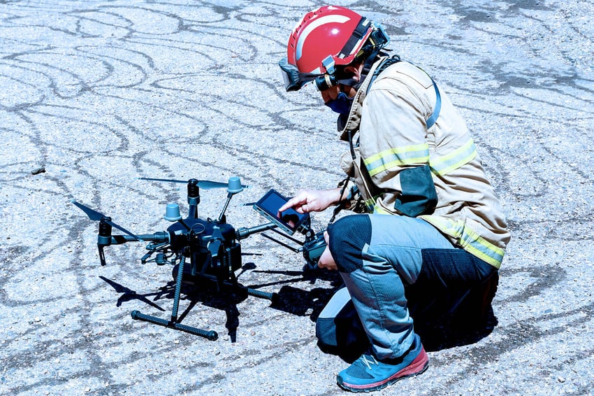 Emergency services worker preparing drone
